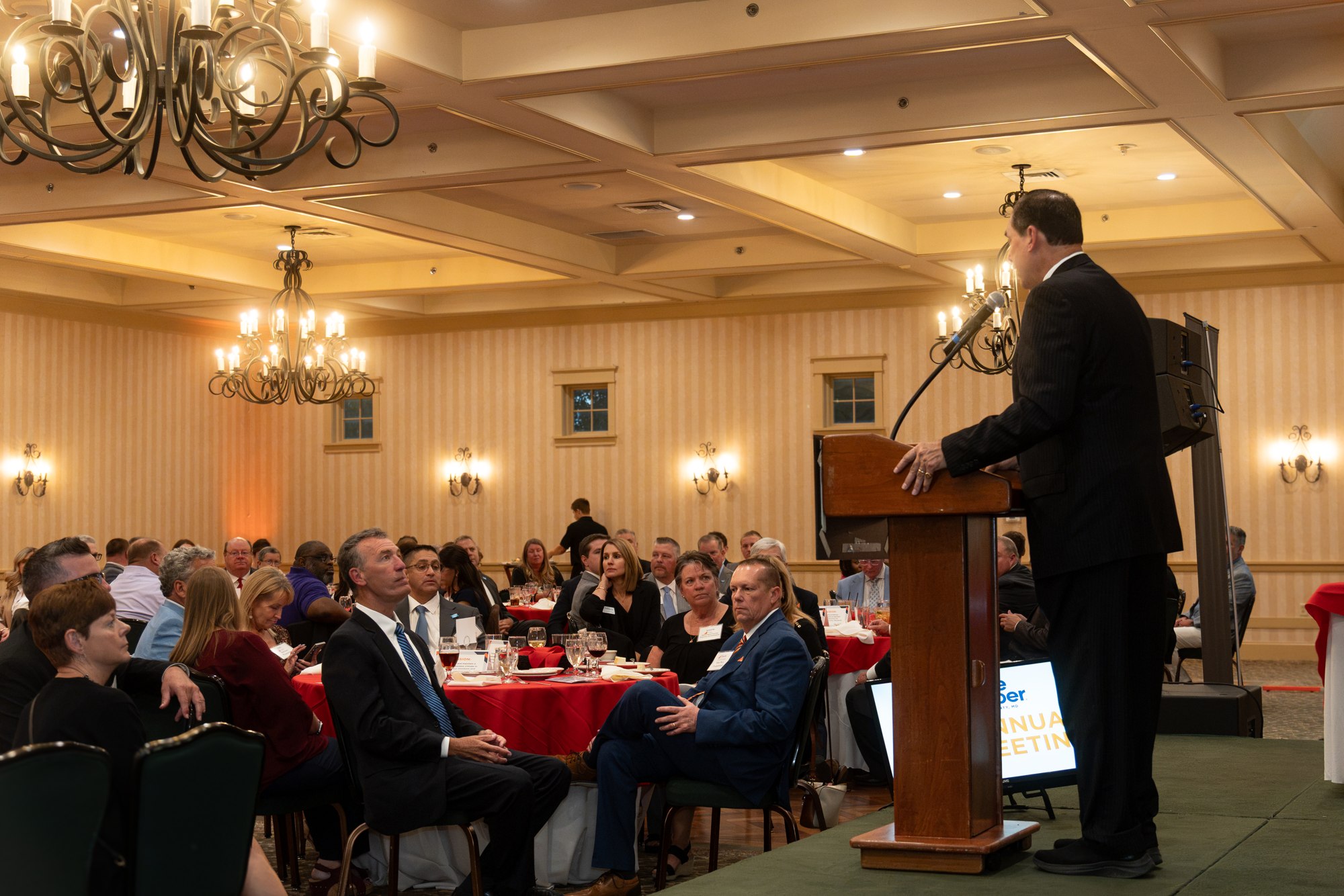 A Chamber speaker addressing a seated audience