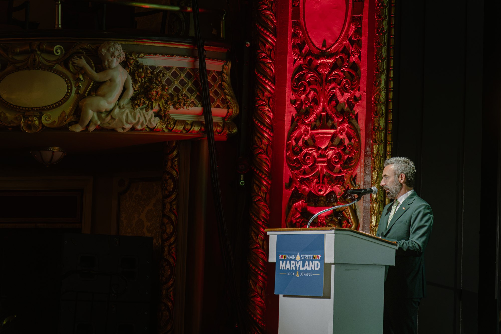 Speaker at the lectern in the Maryland Theatre during Main Street Maryland Conference